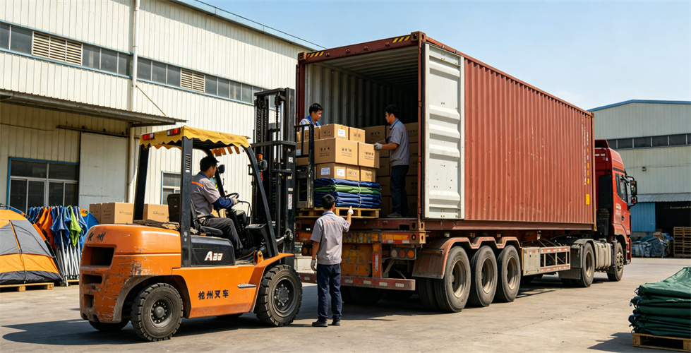 Workers load packed inflatable tent equipment onto a container truck for bulk procurement review