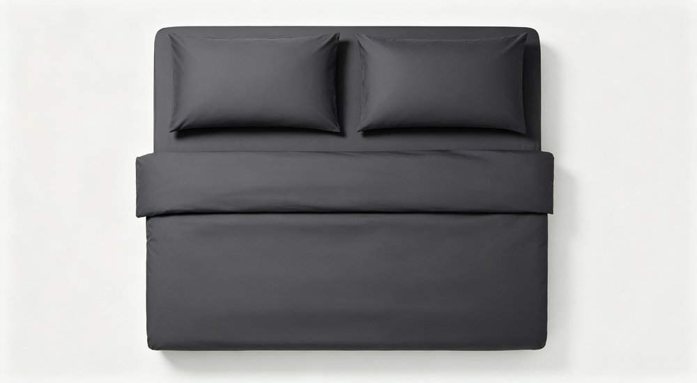 Top-down flat lay of dark grey workforce camp bedding set with two matching pillowcases and folded duvet cover arranged neatly on clean white background for industrial camp use