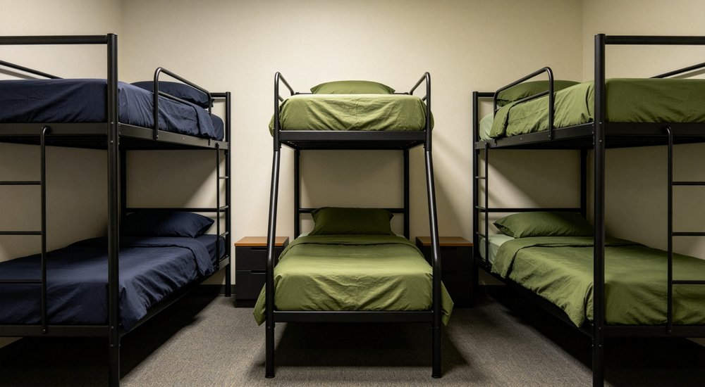 Blankets multi color rolled showing navy and grey institutional bedding for remote worker accommodation and industrial camp facilities