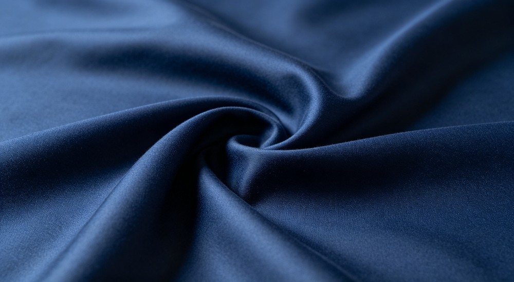 Action polyester microfiber bed sheet fabric texture closeup showing durable synthetic material for fast drying emergency shelter bedding and high frequency washing cycles