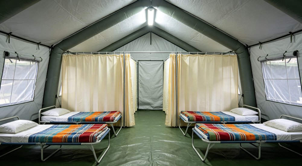 High-quality photo of a 40 square meter inflatable disaster relief tent detailed close-up view showing material texture used in disaster relief and humanitarian aid operations