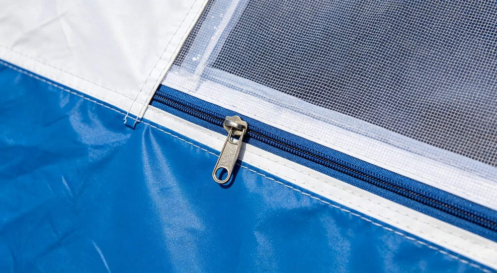 High-quality photo of a 40 square meter inflatable disaster relief tent full exterior view showing complete structure in white color with red cross medical markings