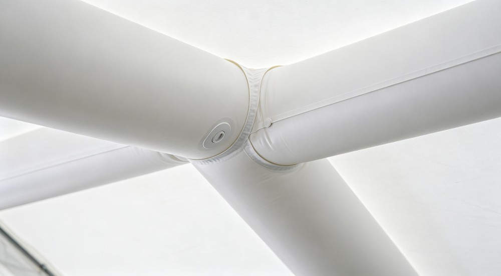 hospital medical inflatable tent internal air beam joint closeup showing sealed connection structure and integrated air valve for supporting frame