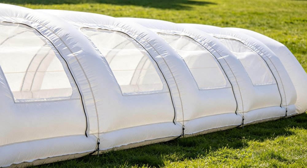 Independent air chambers diagram of inflatable tent showing separate compartments, close-up detail red and white inflatable emergency shelter for disaster relief operations