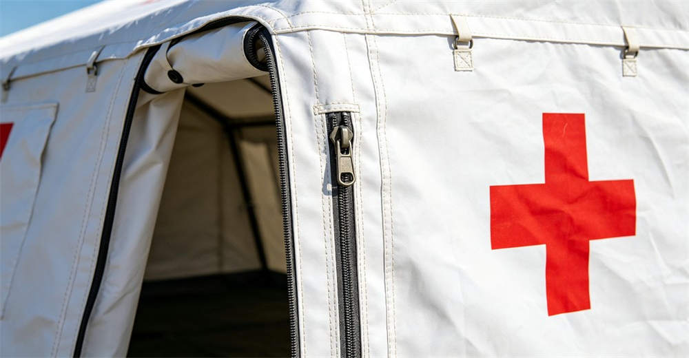 Close-up detail of medical tent entrance with heavy duty zipper door and reinforced seams