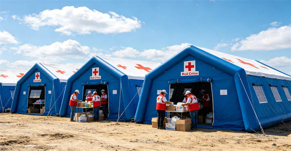 Eye-level of community gathering tent showing blue white large community tent with people gathered for meeting. Professional inflatable disaster relief tent manufactured for humanitarian aid and emergency response operations worldwide. Eye-level of community gathering tent showing blue white large community tent with people gathered for meeting. Professional inflatable disaster relief tent manufactured for humanitarian aid and emergency response operations worldwide.