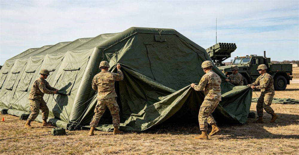 Close-up of electric air pump actively inflating a military tent, showing high-pressure airflow, durable construction, portable design and efficient inflation capability for rapid field deployment in operational conditions