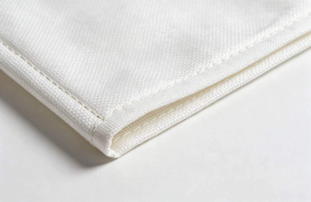 Close up of fire blanket double stitched edge binding showing durable construction for long term storage in emergency kits today
