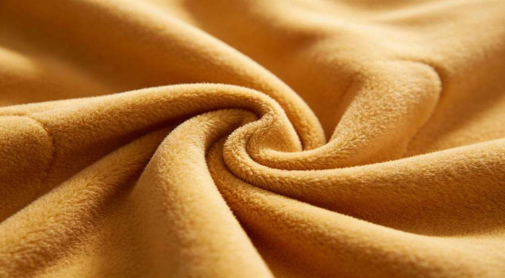 Close up of soft sleeping bag inner lining fabric, skin-friendly material texture, macro photography, comfortable material