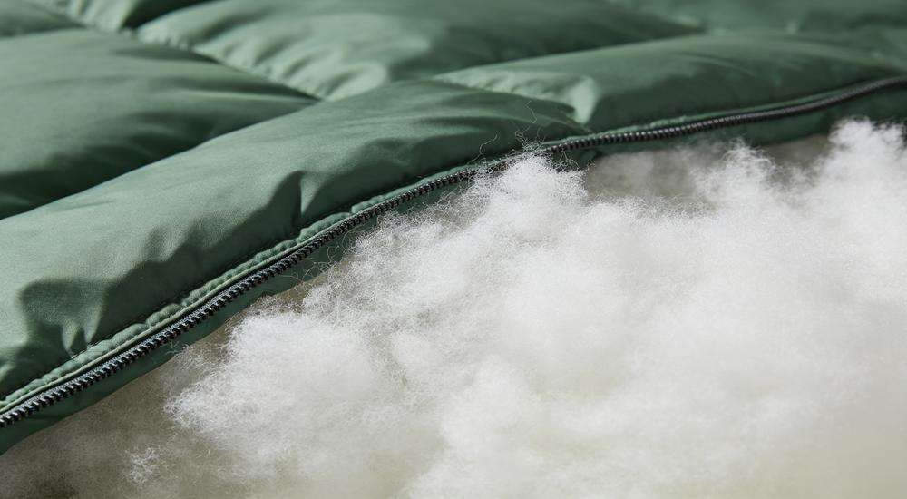 Close up of sleeping bag insulation filling material, hollow fiber polyester wadding, material sample display, warm filling