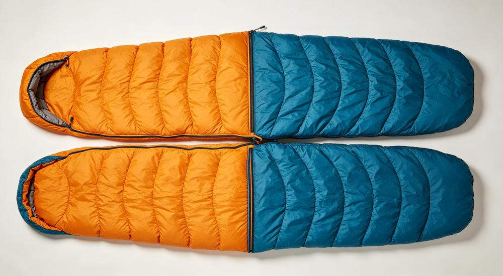 Wide angle emergency shelter tent interior - rows of sleeping bags neatly arranged for disaster relief distribution, emergency sleeping bag deployment, bright natural light