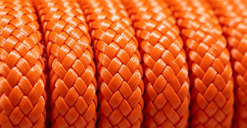 Close-up of smooth nylon water rescue rope braided surface texture showing flexible fiber weave pattern and soft hand feel for reliable water rescue operations and emergency response