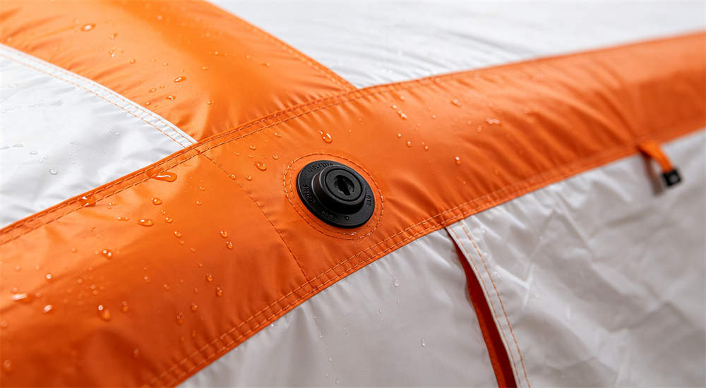 Close up detail of inflatable relief tent showing air valve and waterproof fabric texture with water droplets, product detail for bulk hurricane shelter supplies Close up detail of inflatable relief tent showing air valve and waterproof fabric texture with water droplets, product detail for bulk hurricane shelter supplies
