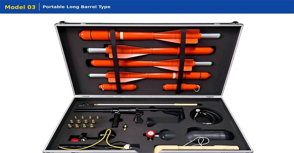 Portable long-barrel pneumatic line thrower on white background, complete kit with red launcher black stock four rocket projectiles and carry case product photo