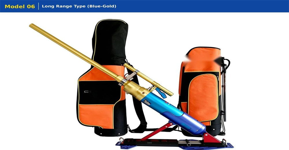 Long-range pneumatic line thrower in blue and gold finish on white background, tripod mounted high pressure rescue rope launcher with orange carry bags product photo