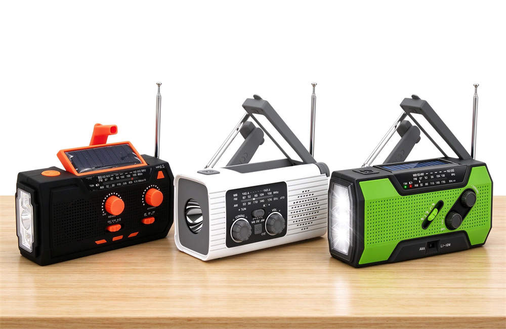 Family of 3 hand crank solar emergency radios in black-orange, white-gray and green-black color options, all with same reliable specs for bulk emergency kit wholesale orders