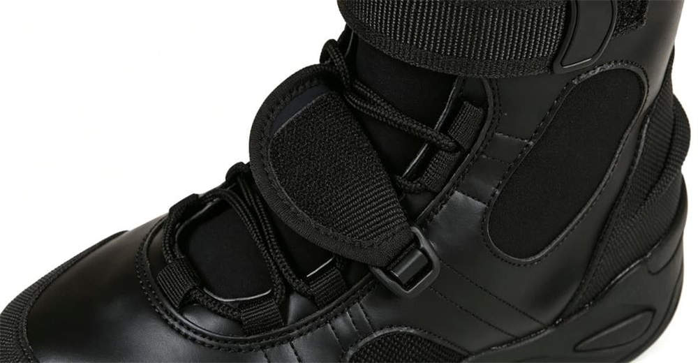 Water rescue operation on rocky river bank, team wearing black leather water rescue boots designed for professional rescue teams and emergency services