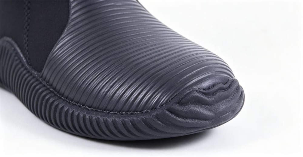 Close-up of feet in neoprene wading boots walking in shallow river water, showing quick drainage and non-slip outsole design for professional rescue teams worldwide. Close-up of feet in neoprene wading boots walking in shallow river water, showing quick drainage and non-slip outsole design for professional rescue teams worldwide.
