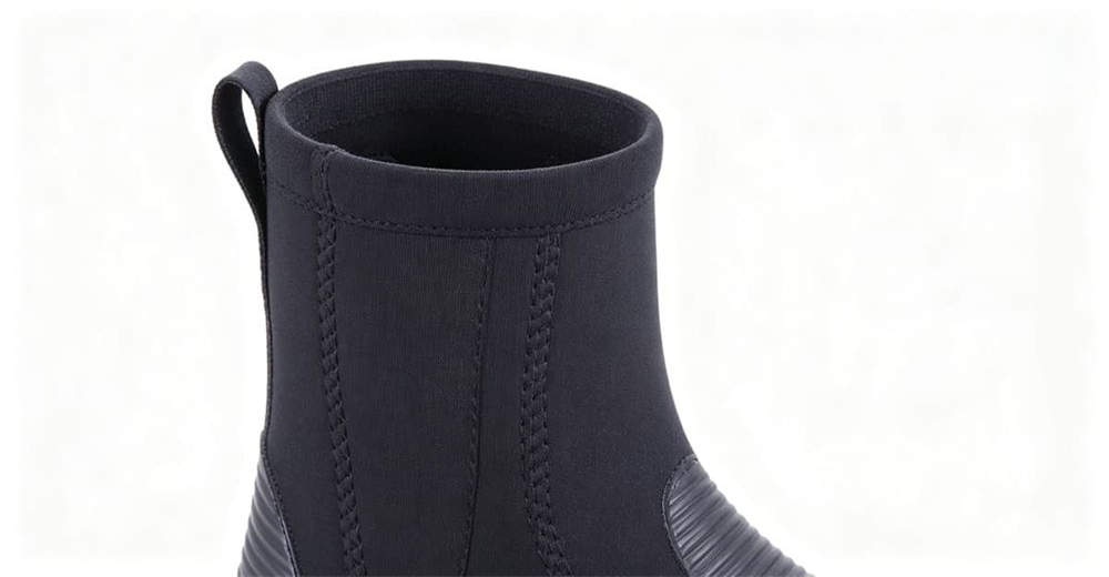 Side angle view of neoprene wading boots showing sleek professional design and short ankle height for shallow water for rescue operations Side angle view of neoprene wading boots showing sleek professional design and short ankle height for shallow water for rescue operations