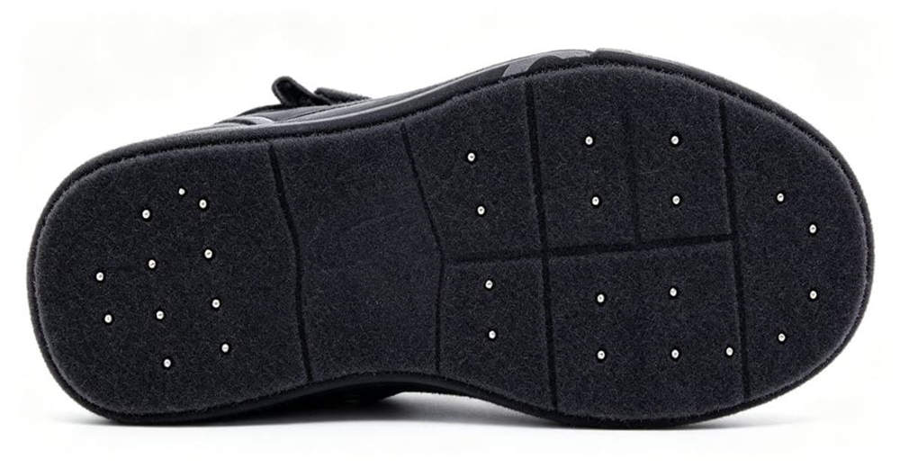 Close-up of deep lug outsole on ice rescue boots, designed for maximum traction on wet rocky and uneven terrain for professional rescue teams worldwide.