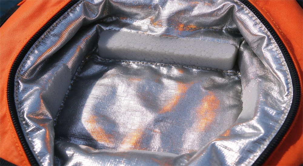 Thermal reflective inner liner silver coating detail of ice rescue suit showing closed cell foam insulation and heat reflective material for cold water rescue gear warmth retention