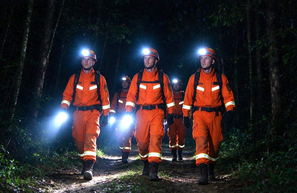 Night-time view of orange washable fr wildland firefighting clothing washing line drying for forest fire suit care guidance and wildland fire gear maintenance for repeated use
