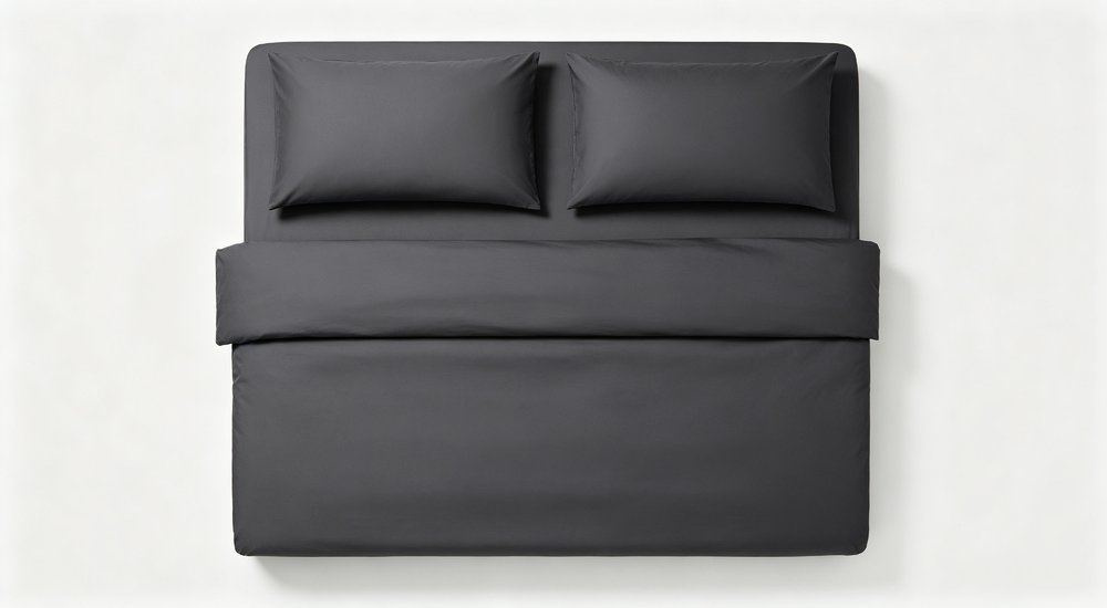 Side angle of heavy duty workforce camp bedding set laid flat in dark gray and navy on a neutral background, reinforced stitched duvet cover sheet and pillowcase, construction camp bedding wholesale product family