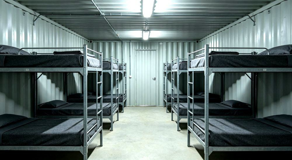 Close-up of mining container dormitory interior with gray workforce camp bedding on bunk beds, modular camp housing for remote mining workforce accommodation for heavy duty camp linen wholesale from a China manufacturer. Close-up of mining container dormitory interior with gray workforce camp bedding on bunk beds, modular camp housing for remote mining workforce accommodation for heavy duty camp linen wholesale from a China manufacturer.