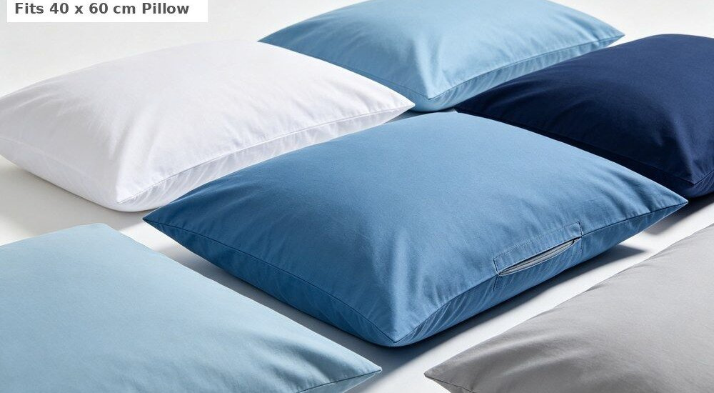 Close-up view of white pillowcase product close-up for institutional bulk bedding showing an envelope closure and neat stitching, part of the matching three-piece sheet and duvet cover set for wholesale supply to institutions.