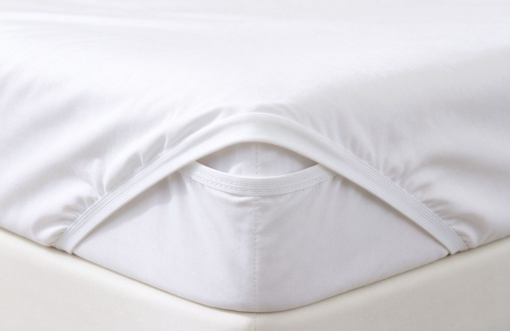 Deep pocket detail of fitted sheet with heavy duty elastic for massage table pad, massage table fitted sheet 7 inch pocket gripping the cushion through full shifts of daily client use