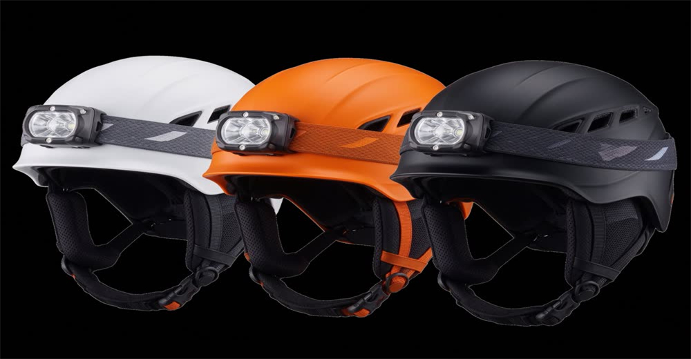 Front view of white ski rescue helmet with attached goggles showing protective headgear for avalanche rescue