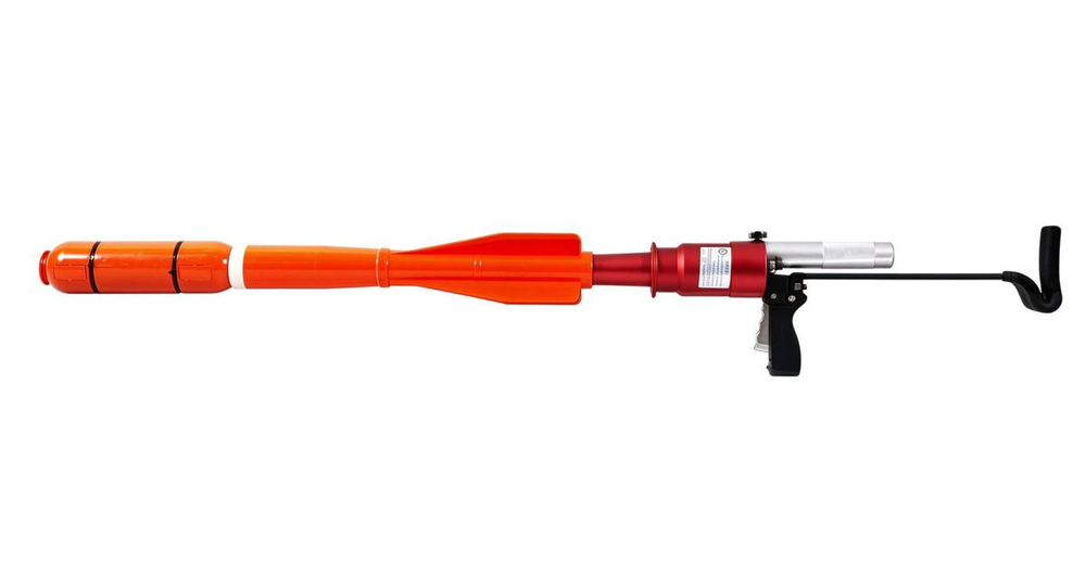Orange portable CO2 pneumatic line thrower with folding stock macro detail showing durable construction for long service life in professional water rescue operations